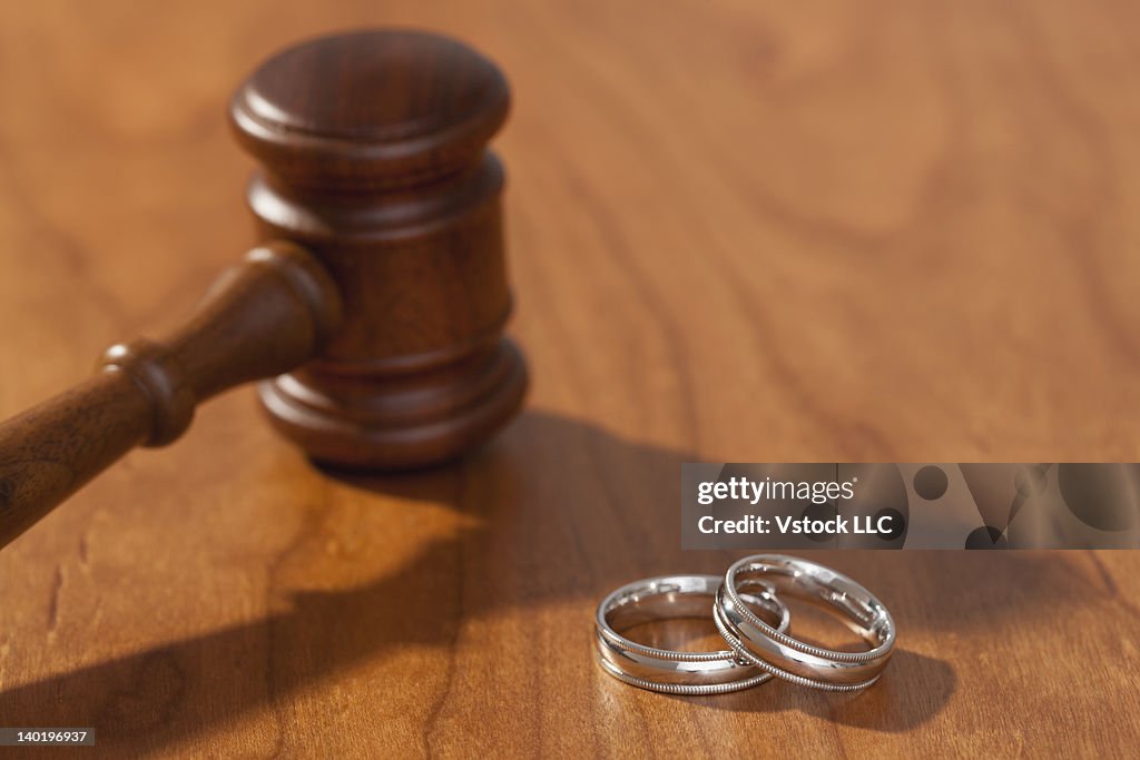 Silver wedding rings and gavel