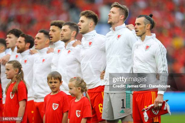 Wales players sing their national anthem during the FIFA World Cup Qualifying Playoff match between Wales and Ukraine at Cardiff City Stadium on June...