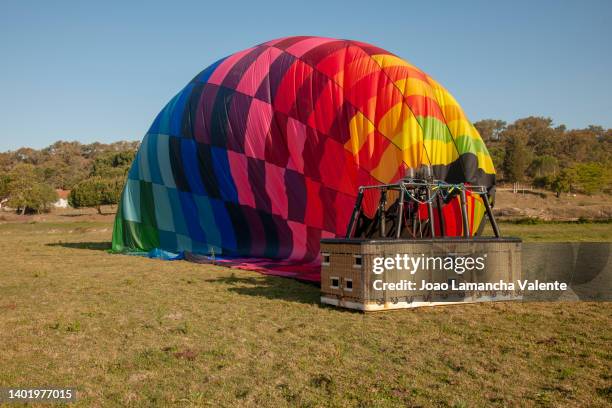 hot air balloon - blowing balloon stock pictures, royalty-free photos & images