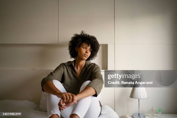 woman with depression at home - crying sad african woman stock pictures, royalty-free photos & images