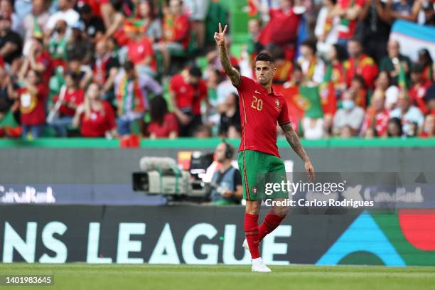 Joao Cancelo of Portugal celebrates after scoring their side's first goal during the UEFA Nations League League A Group 2 match between Portugal and...