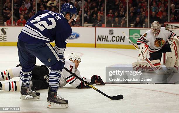 Brent Seabrook of the Chicago Blackhawks falls to ice to stop a shot against Ray Emery by Tyler Bozak of the Toronto Maple Leafs at the United Center...