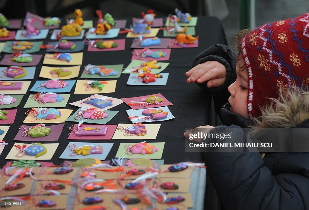 A child looks at "martisor" to be sold a