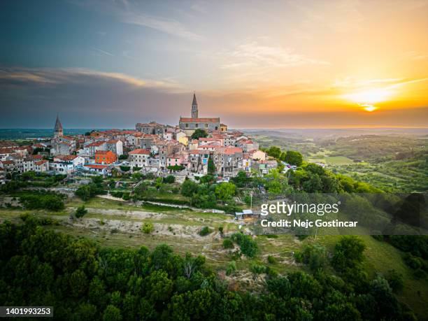 aerial view of an picturesque medieval town in istria, croatia - buje at sunset - istria stock pictures, royalty-free photos & images