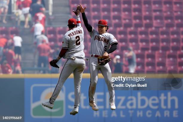 Geraldo Perdomo and Alek Thomas of the Arizona Diamondbacks celebrate after beating the Cincinnati Reds 5-4 at Great American Ball Park on June 09,...