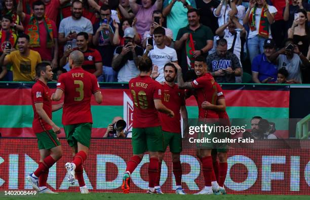 Goncalo Guedes of Valencia FC and Portugal celebrates with teammates after scoring a goal during the UEFA Nations League - Group 2 match between...