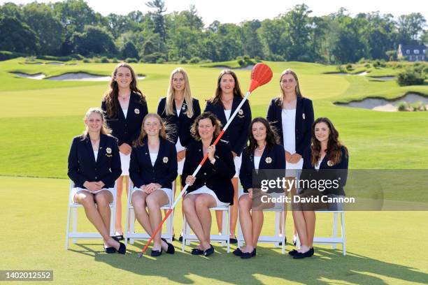 The Great Britain and Ireland Team are pictured with one of the unique Merion Golf Club 'Wicker basket' pin flags ; Seated Emily Price, Louise...