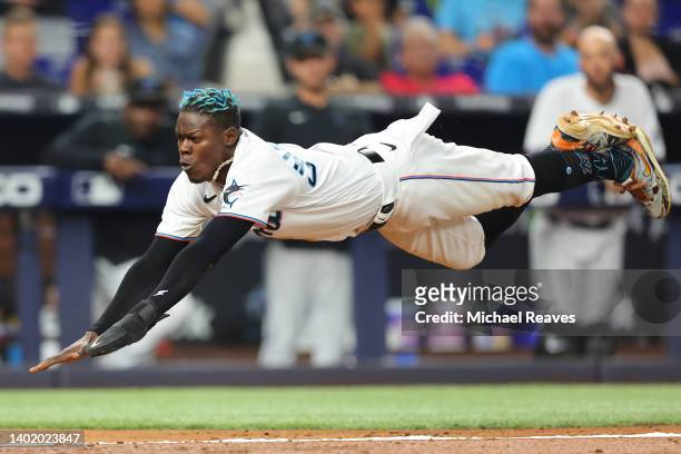 Jazz Chisholm Jr. #2 of the Miami Marlins slides home safely to score a run during the fifth inning against the Washington Nationals at loanDepot...
