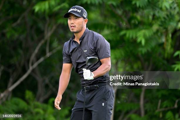 Satoshi Kodaira of Japan follows his shot from the fifth tee during the first round of the RBC Canadian Open at St. George's Golf and Country Club on...