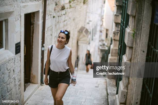 young woman sightseeing on vacation - croatia tourist stock pictures, royalty-free photos & images