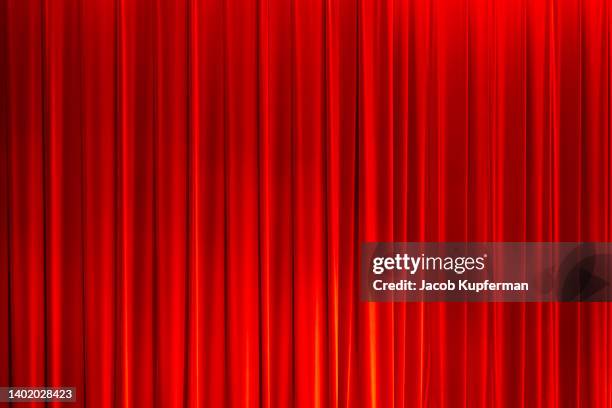 red curtains in front of a stage - theatre awards stock pictures, royalty-free photos & images