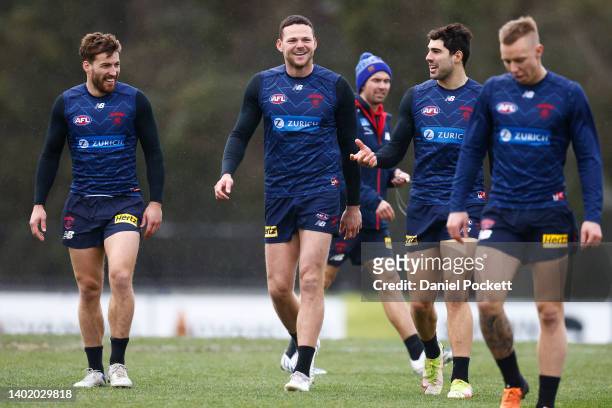 Steven May of the Demons shares a laugh with Jack Viney and Christian Petracca during a Melbourne Demons AFL training session at Casey Fields on June...