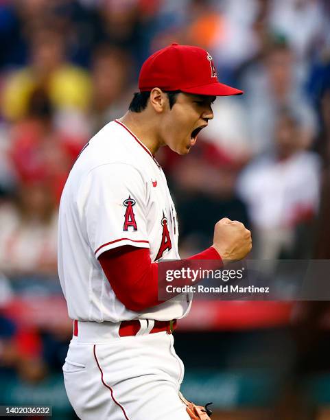 Shohei Ohtani of the Los Angeles Angels reacts after a strike out against Rafael Devers of the Boston Red Sox in the third inning at Angel Stadium of...