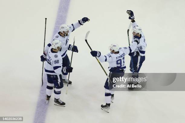 Mikhail Sergachev of the Tampa Bay Lightning celebrates with teammates after scoring the go-ahead goal during the third period against the New York...