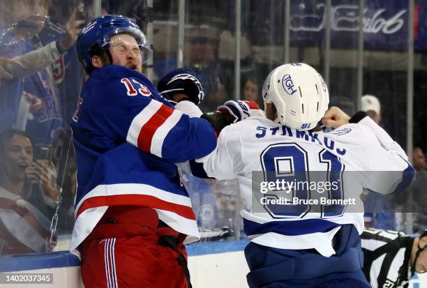 Steven Stamkos of the Tampa Bay Lightning fights with Alexis Lafrenière of the New York Rangers at the end of the third period in Game Five of the...