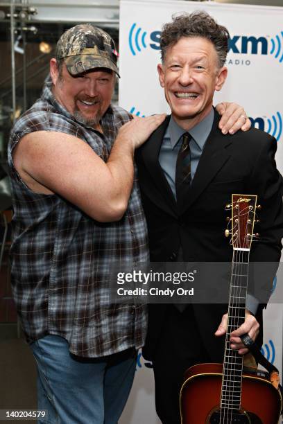 Comedian Larry the Cable Guy meets singer Lyle Lovett at SiriusXM Studio on February 29, 2012 in New York City.