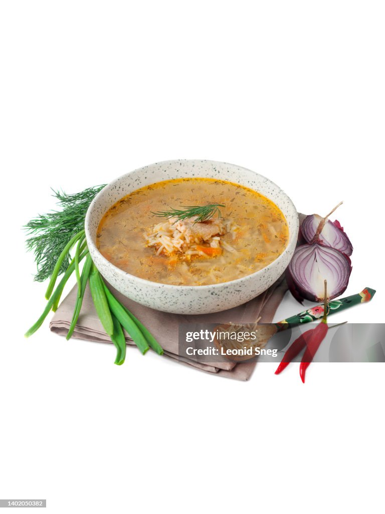 Chicken soup with vermicelli on white background isolated