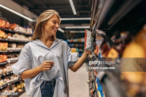 which snack to buy - grocery shelf stock pictures, royalty-free photos & images