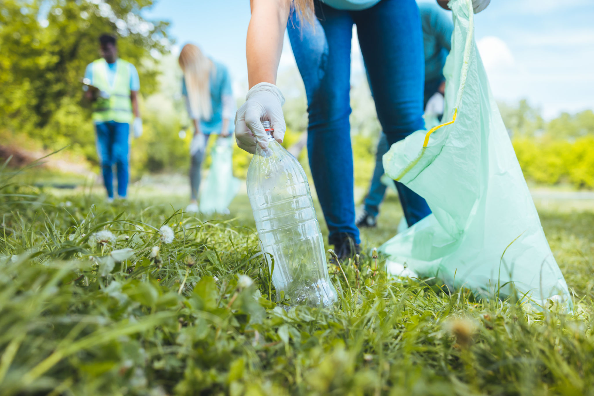An unrecognizable woman holds a plastic garbage bottle An unrecognizable woman holds a plastic garbage bottle