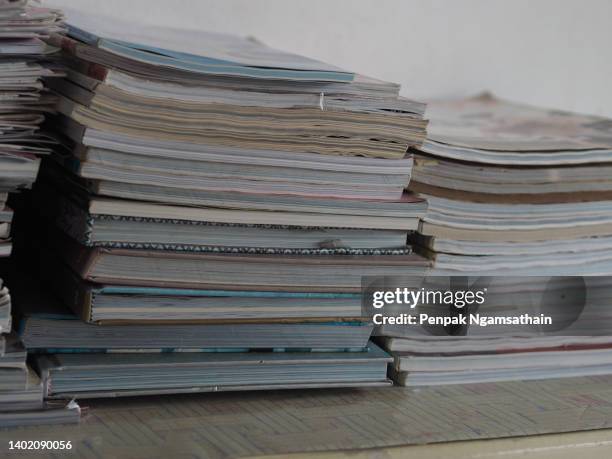 many books stacked on top of cabinets, group of object - magazine publication stock pictures, royalty-free photos & images