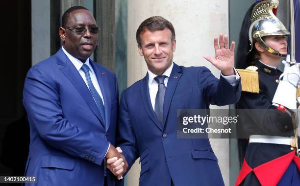 French President Emmanuel Macron welcomes his Senegalese counterpart Macky Sall prior to their bilateral meeting at the Elysee presidential palace on...