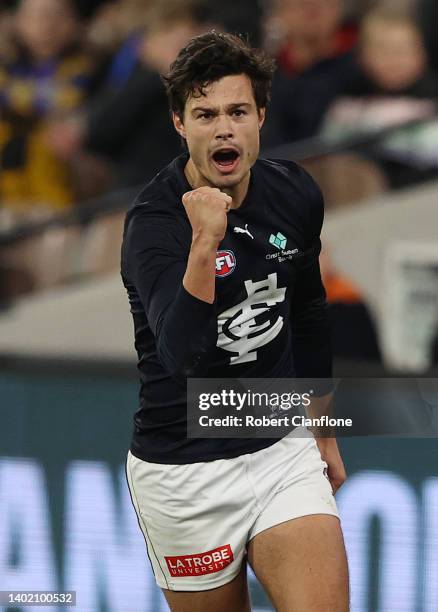 Jack Silvagni of the Blues celebrates after scoring a goal during the round 13 AFL match between the Essendon Bombers and the Carlton Blues at...