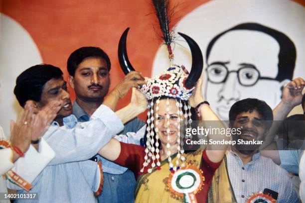 Chhattisgarh Chief Minister Ajit Jogi presents a traditional headgear to Congress president Sonia Gandhi at a dalit rally in New Delhi on August 21,...