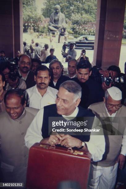 Finance Minister Yashwant Singh carrying annual budget papers in a brief case entering the Parliament building in New Delhi on February 29, 2000.