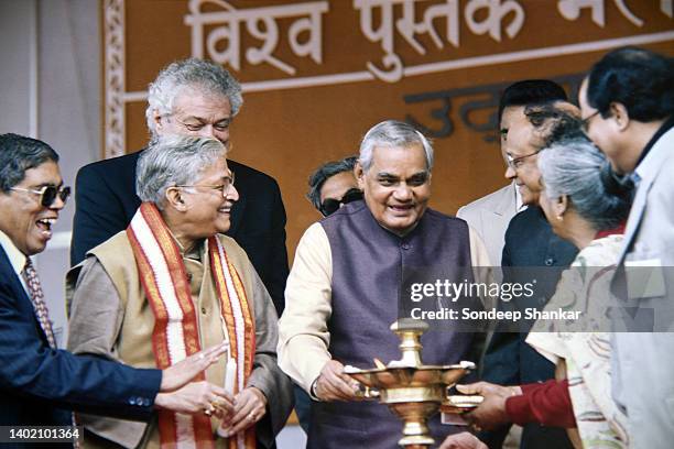 Prime Minister Atal Behari Vajpayee lights an oil lamp to mark an auspicious begining of the World Book Fair in New Delhi, February 05, 2000.