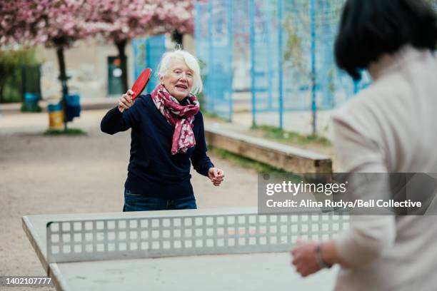 senior women playing table tennis - showus sport stock pictures, royalty-free photos & images