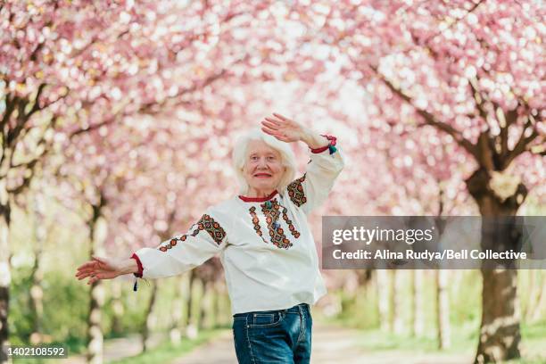 senior woman in an embroidered shirt - vyshyvanka stock pictures, royalty-free photos & images