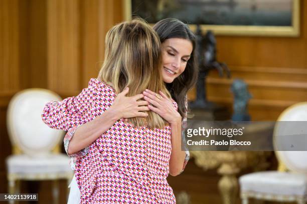 Queen Letizia of Spain hugs Fidela Miron Torrente during an audience at the Zarzuela Palace on June 10, 2022 in Madrid, Spain.