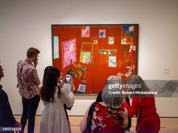 Museum goers attend the exhibition of the paintings of French artist Henri Matisse titled The Red Studio June 9, 2022 at the Museum of Modern Art in...