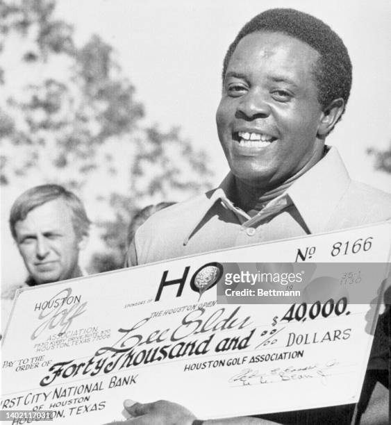 Lee Elder is seen here with his check for winning first place at the Houston Open.