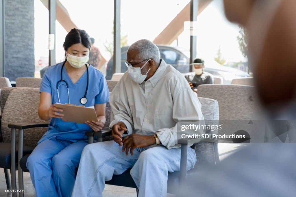 Nurse helps elderly patient