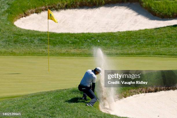 Aaron Rai of England plays his shot from the bunker on the 13th hole during the second round of the RBC Canadian Open at St. George's Golf and...