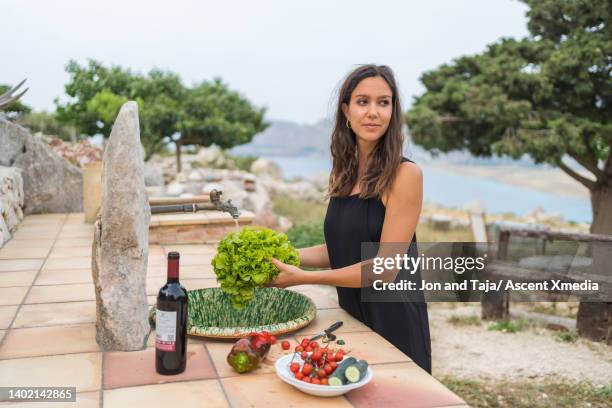 young woman prepares healthy outdoor meal - summer frock stock pictures, royalty-free photos & images