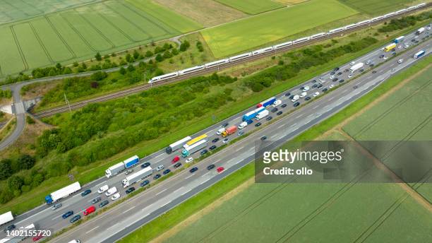 dense traffic on highway - aerial view - high speed train germany stock pictures, royalty-free photos & images