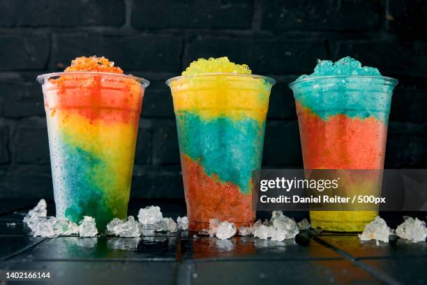 glasses full of tasty slush drinks - スノーコーン ストックフォトと画像