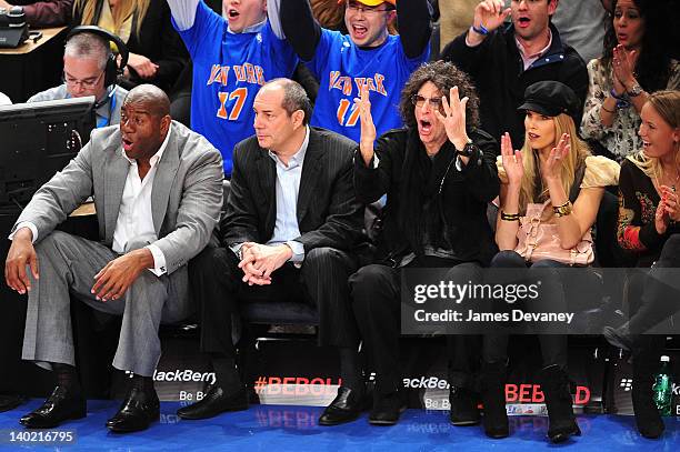 Magic Johnson, guest, Howard Stern and Beth Ostrosky attend the Cleveland Cavaliers vs the New York Knicks game at Madison Square Garden on February...