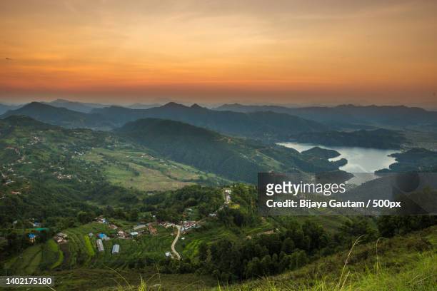 scenic view of landscape against sky during sunset,pokhara,nepal - pokhara stock pictures, royalty-free photos & images