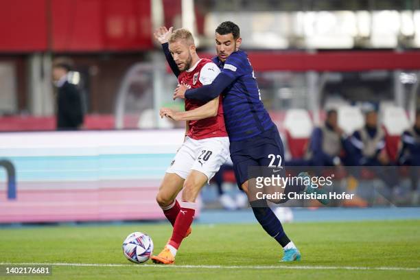 Konrad Laimer of Austria battles for possession with Theo Hernandez of France during the UEFA Nations League - League A Group 1 match between Austria...