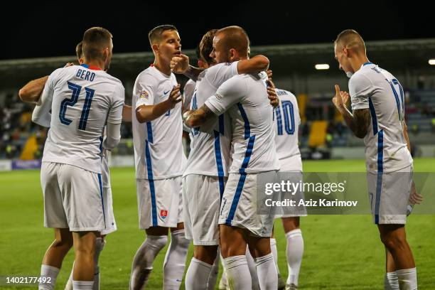 Vladimir Weiss celebrates scoring their first goal with teammates during the UEFA Nations League League C Group 3 match between Azerbaijan and...