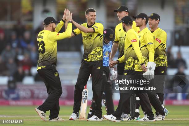 David Payne of Gloucestershire is congratulated after dismissing Tim Seifert of Sussex Sharks during the Vitality T20 Blast between the Sussex Sharks...