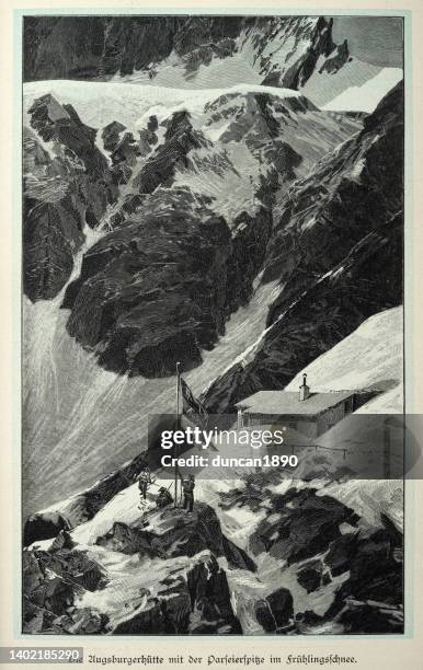 vintage illustration, augsburger hütte with the parseierspike in the spring snow, victorian 19th century - ski lodge stock illustrations
