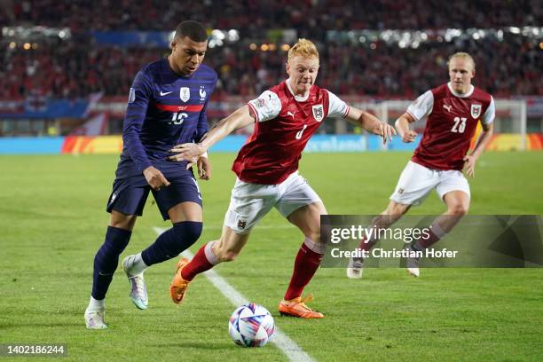 Kylian Mbappe of France battles for possession with Nicolas Seiwald of Austria during the UEFA Nations League - League A Group 1 match between...