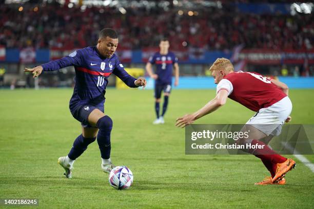 Kylian Mbappe of France battles for possession with Nicolas Seiwald of Austria during the UEFA Nations League - League A Group 1 match between...