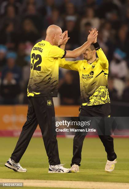 Zak Chappell of Gloucestershire is congratulated after dismissing Harrison Ward of Sussex Sharks during the Vitality T20 Blast between the Sussex...