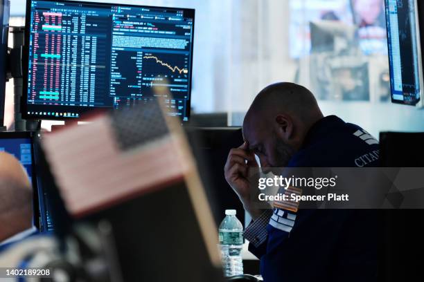 Traders work on the floor of the New York Stock Exchange on June 10, 2022 in New York City. Stocks fell over 800 points on Friday as inflation fears...