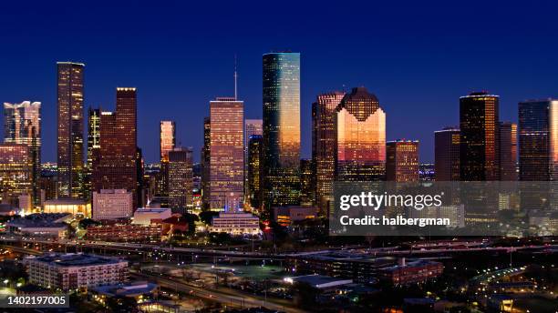 drone shot of downtown houston, texas at night - houston skyline stock pictures, royalty-free photos & images